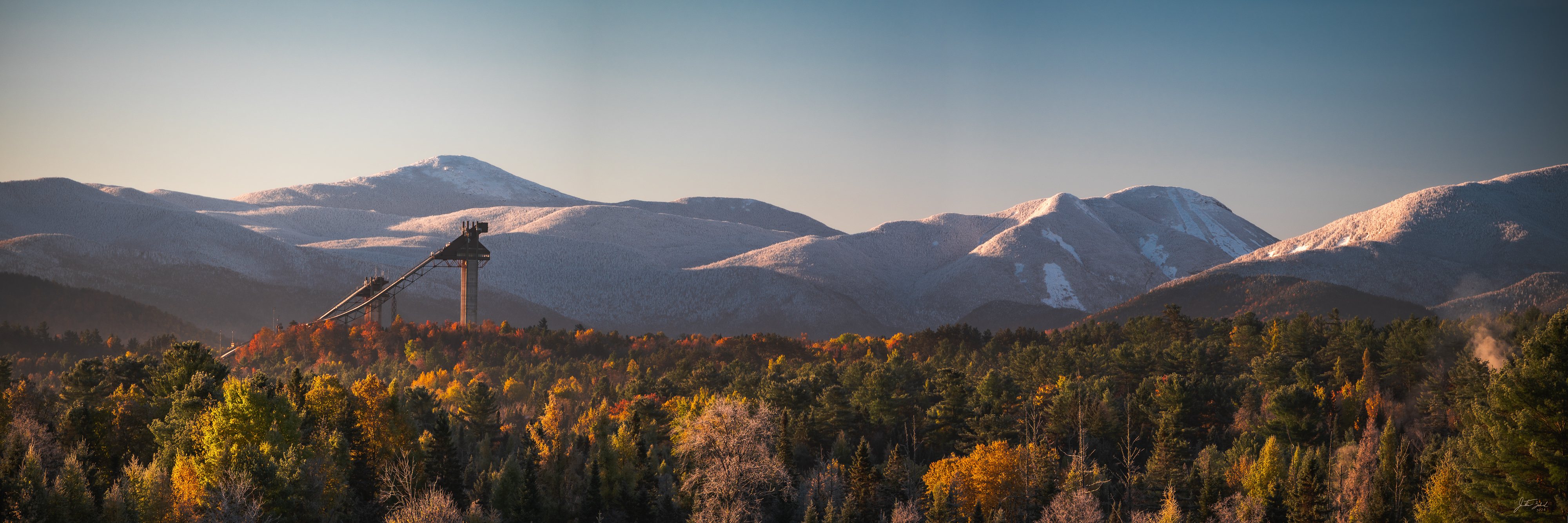 Morning Light over Ski Jumps and High Peaks