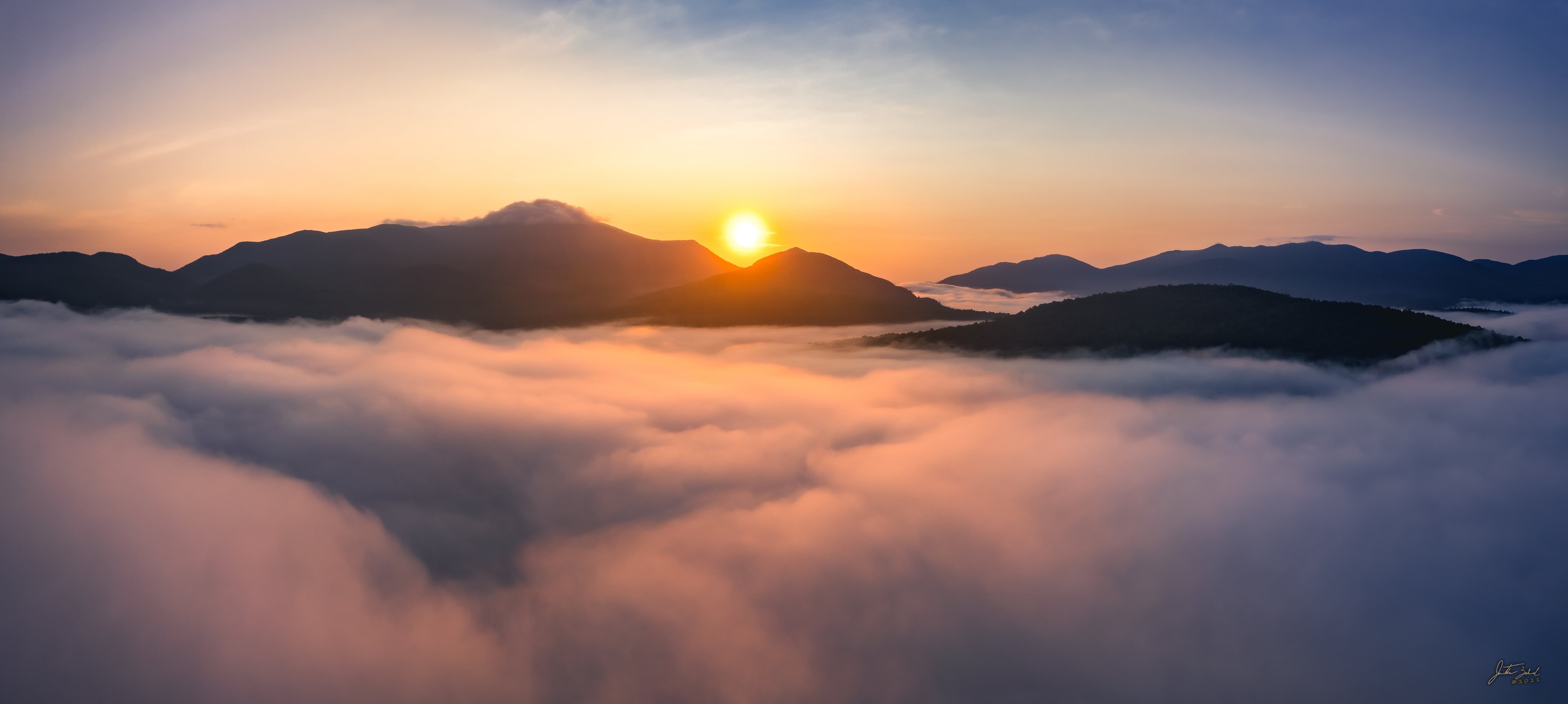 Above the clouds sunrise overlooking Whiteface