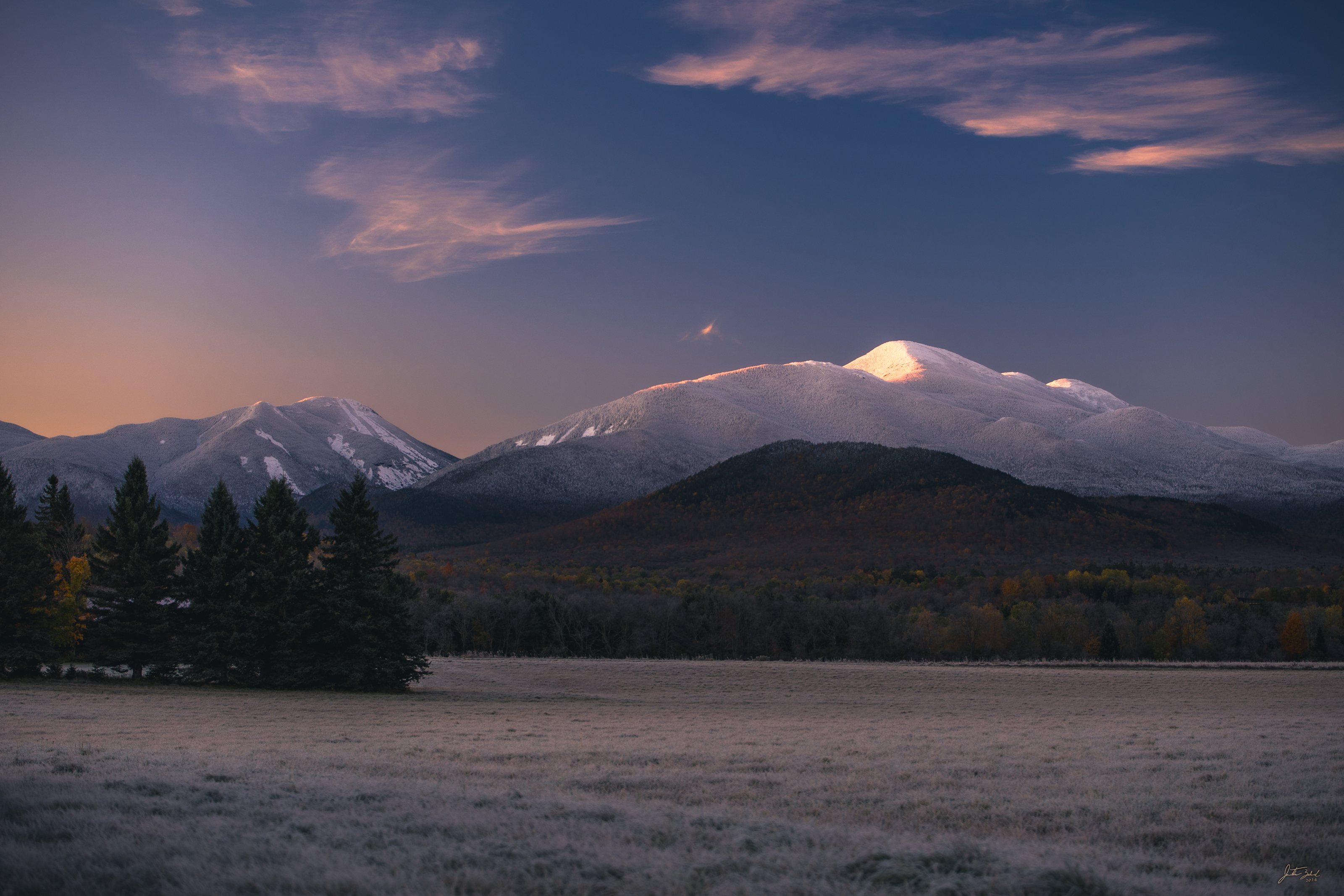 Alpine Glow on Snow-Capped High Peaks