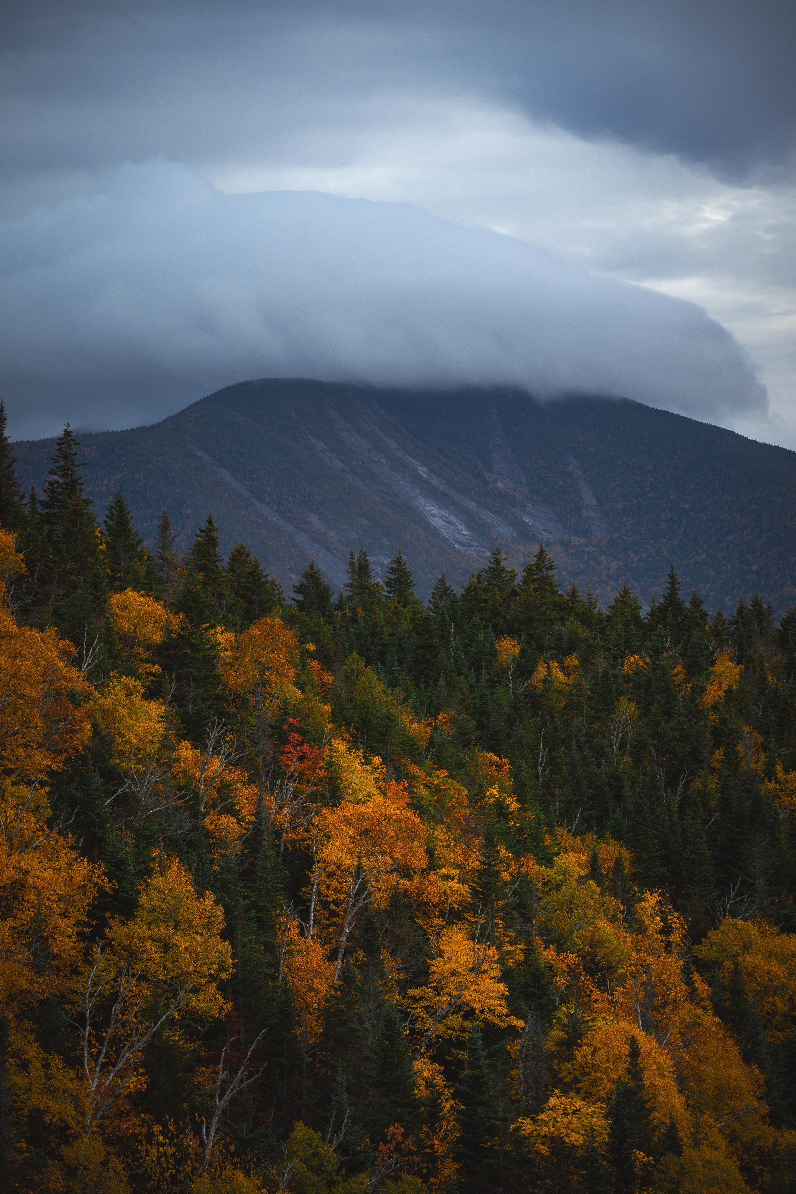 From Noonmark, I watched a low cloud settle over Dix at a moody sunset. View toward Dix Mountain from Noonmark Mountain, Adirondack High Peaks, New York.