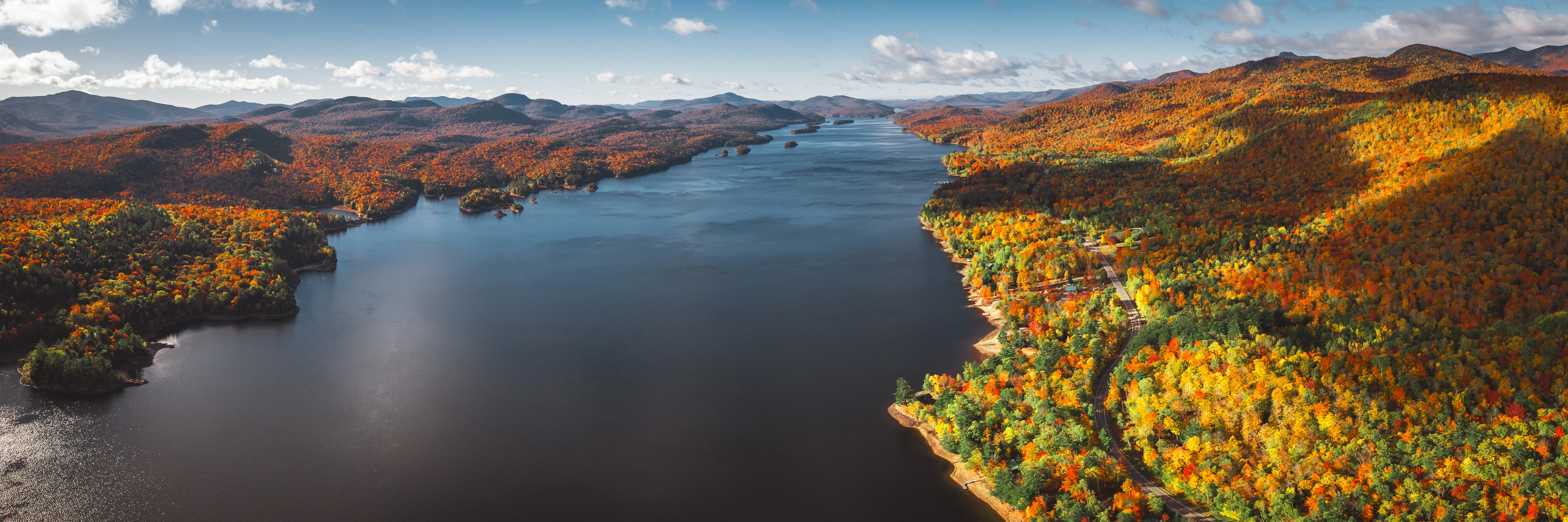 Looking south over Indian Lake, autumn color traces every inlet and island. Indian Lake, Adirondacks, New York.