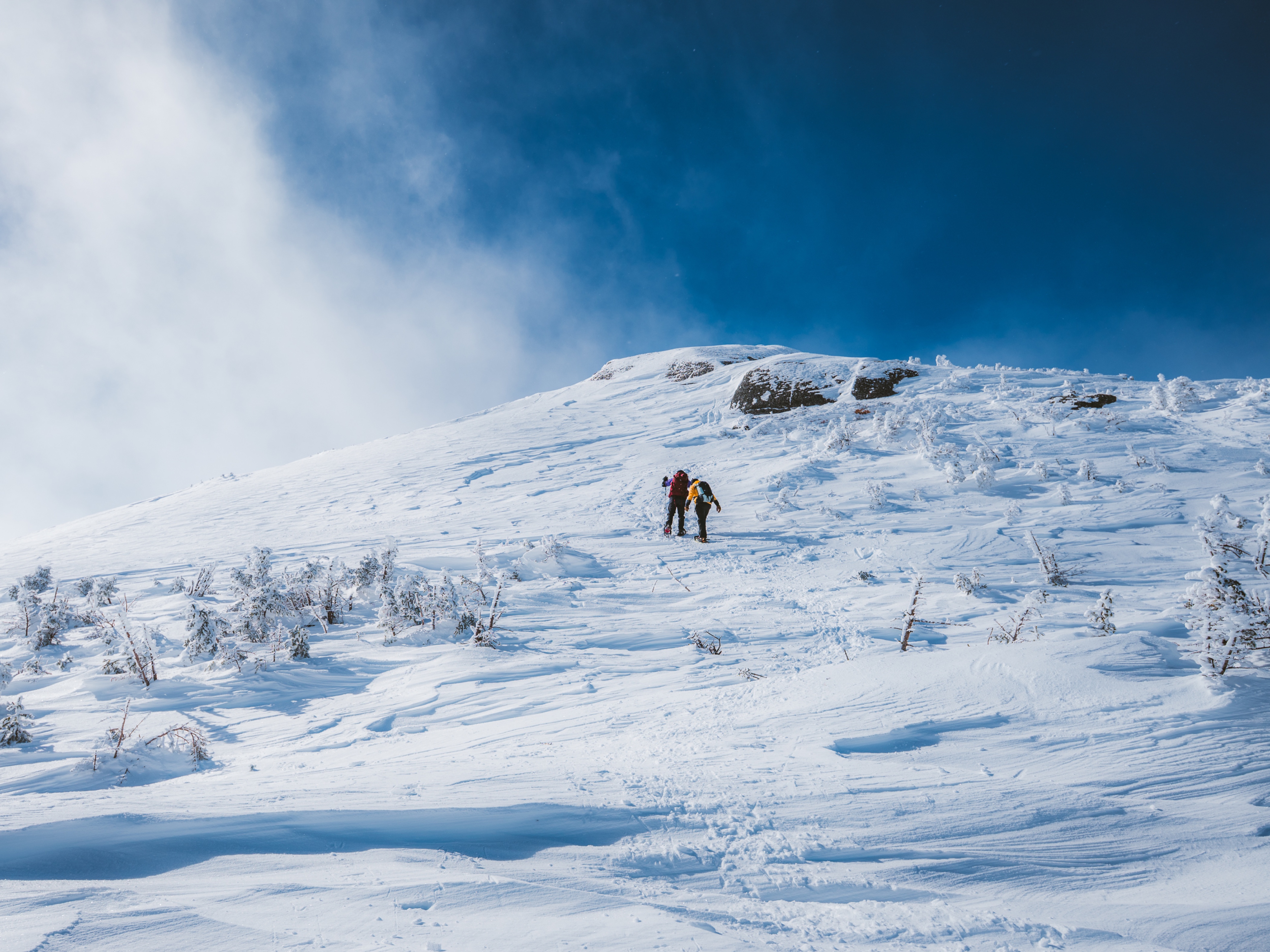 Winter Hikers Ascending Iroquois Peak